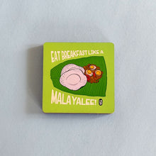 Square magnet with food illustration and text on a light gray background