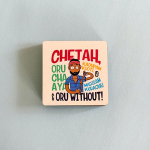 Square wooden coaster with colorful design and text on a light gray background